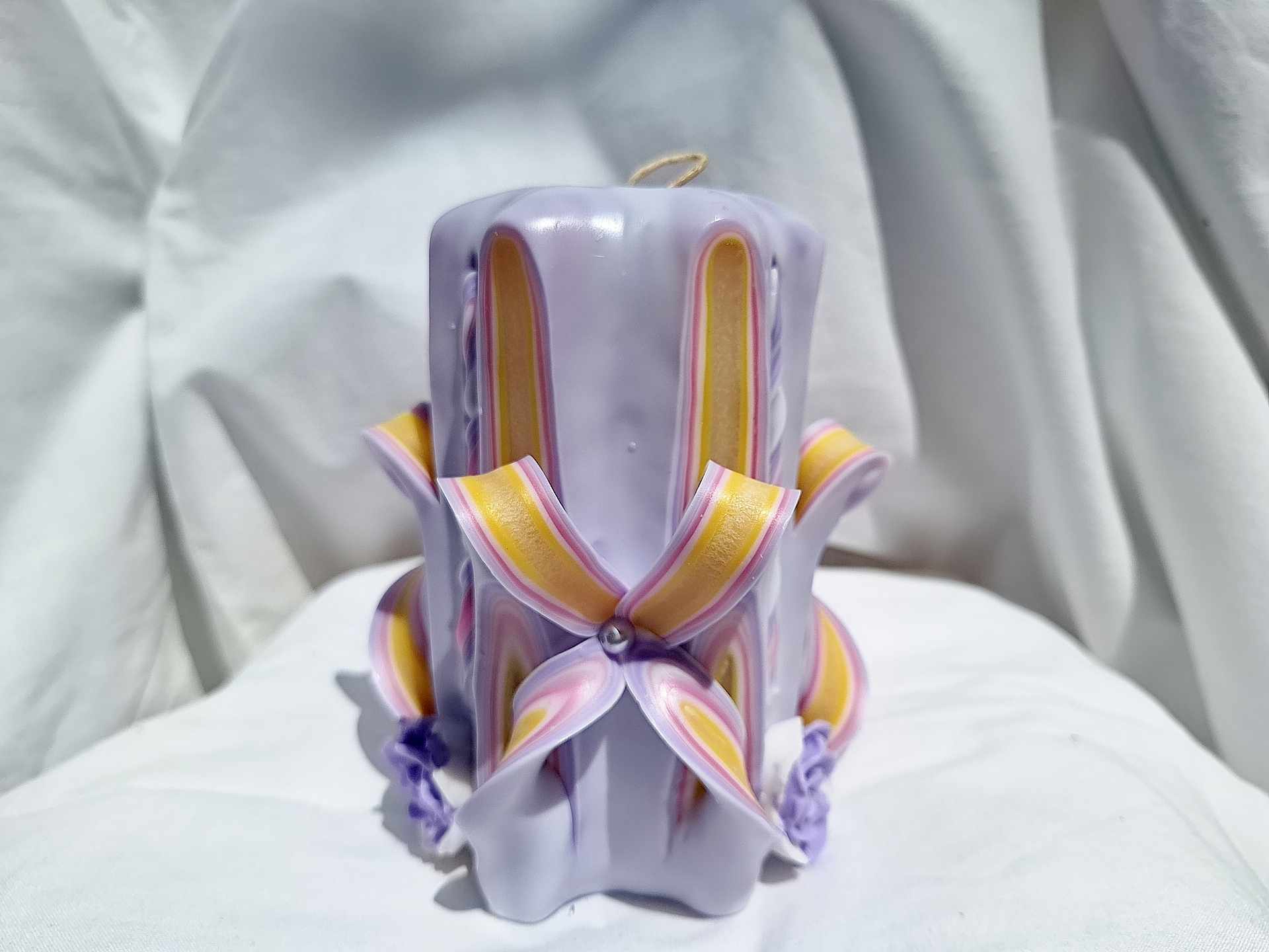 Handmade floral purple carved candle