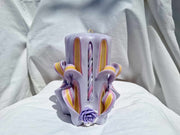 Handmade floral purple carved candle