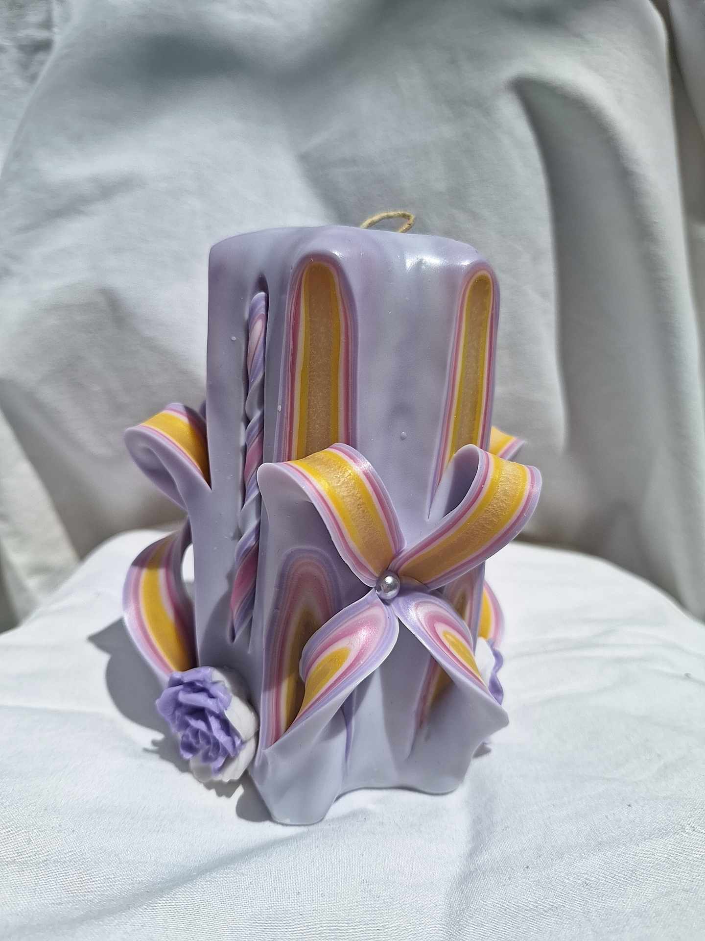 Handmade floral purple carved candle