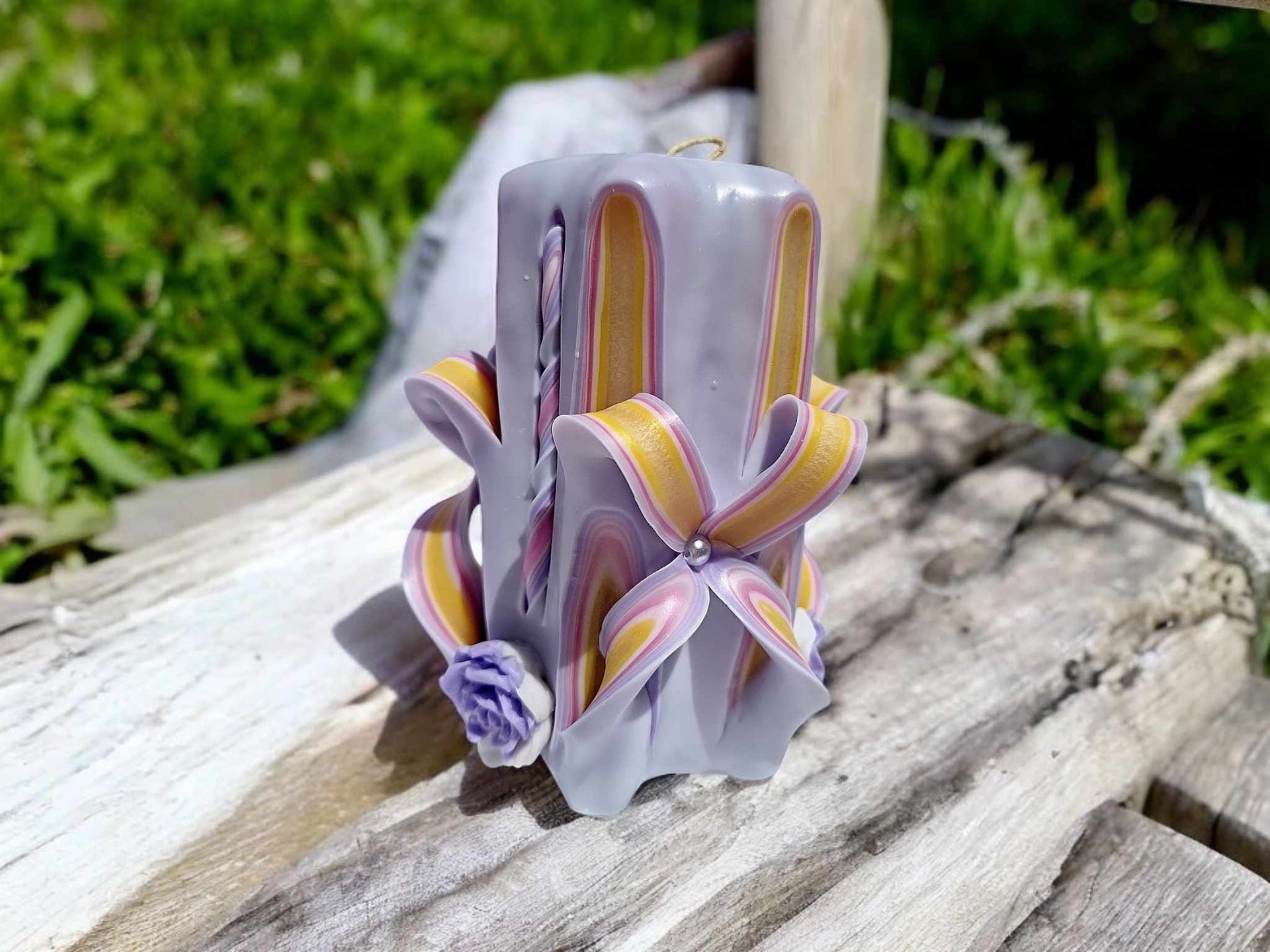 Handmade floral purple carved candle