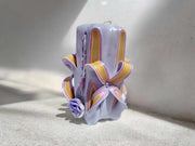 Handmade floral purple carved candle