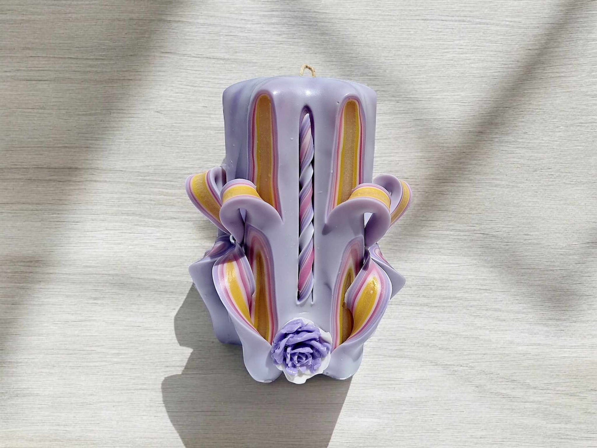 Handmade floral purple carved candle
