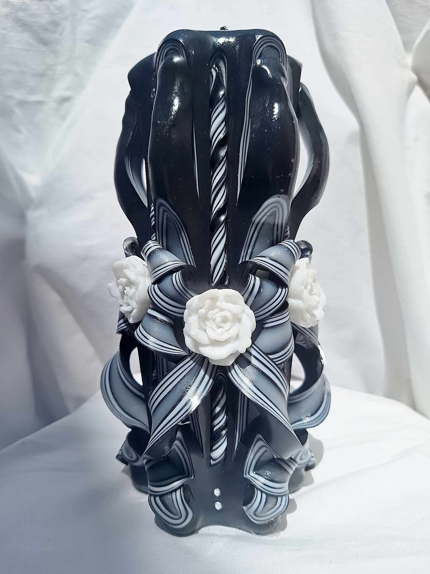 Black and white carved rose candle floral design