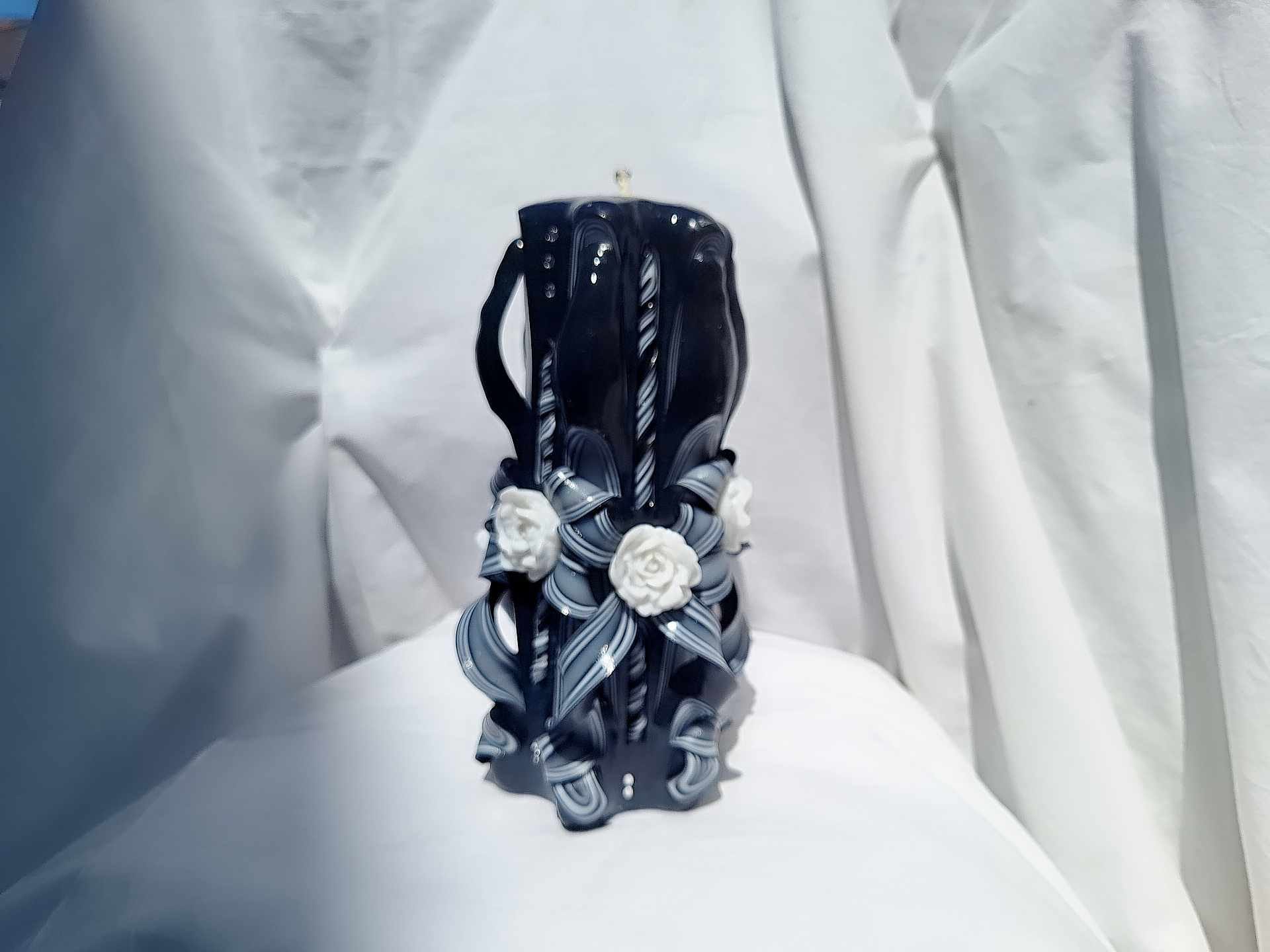 Black and white carved rose candle floral design