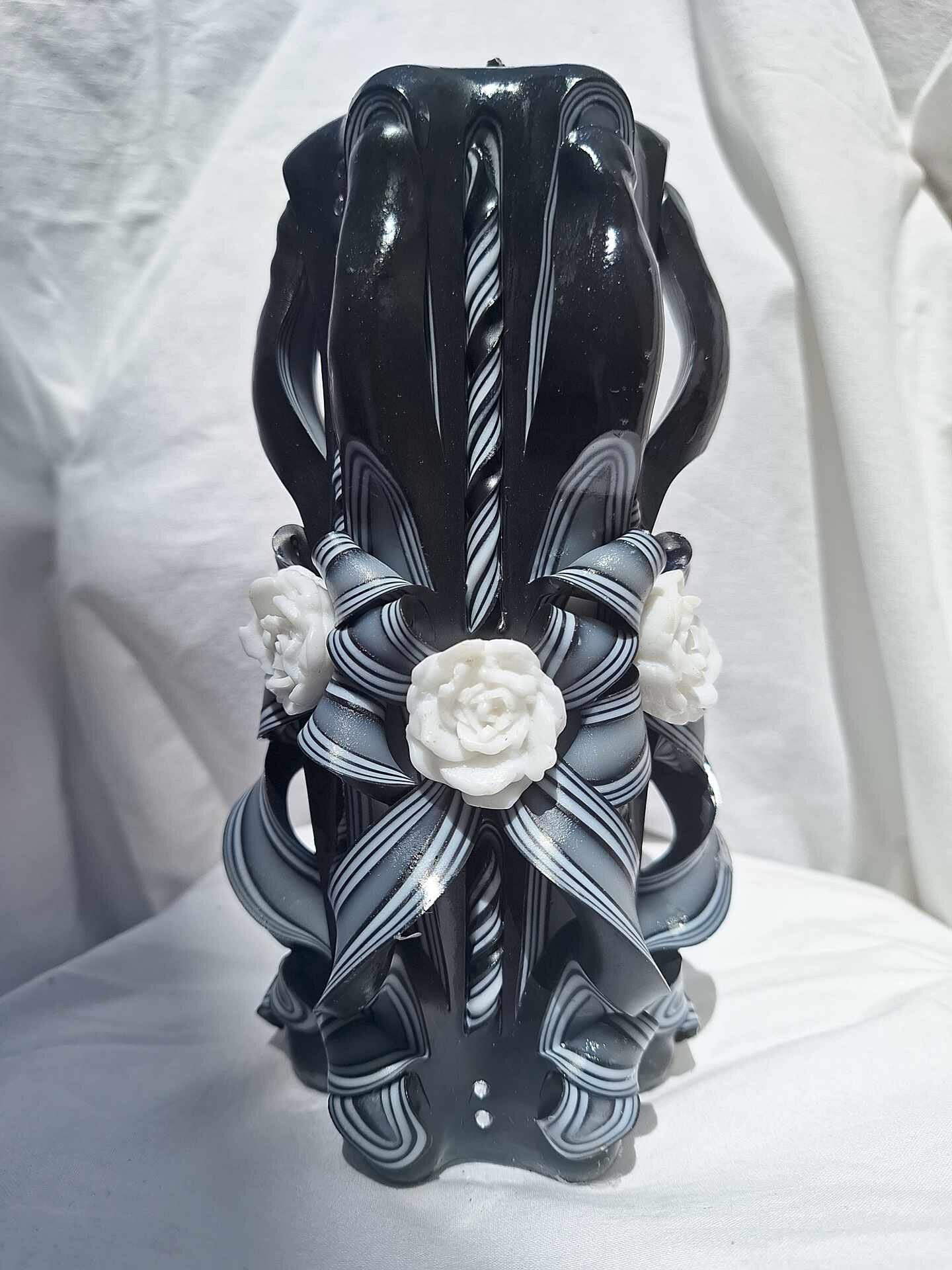 Black and white carved rose candle floral design