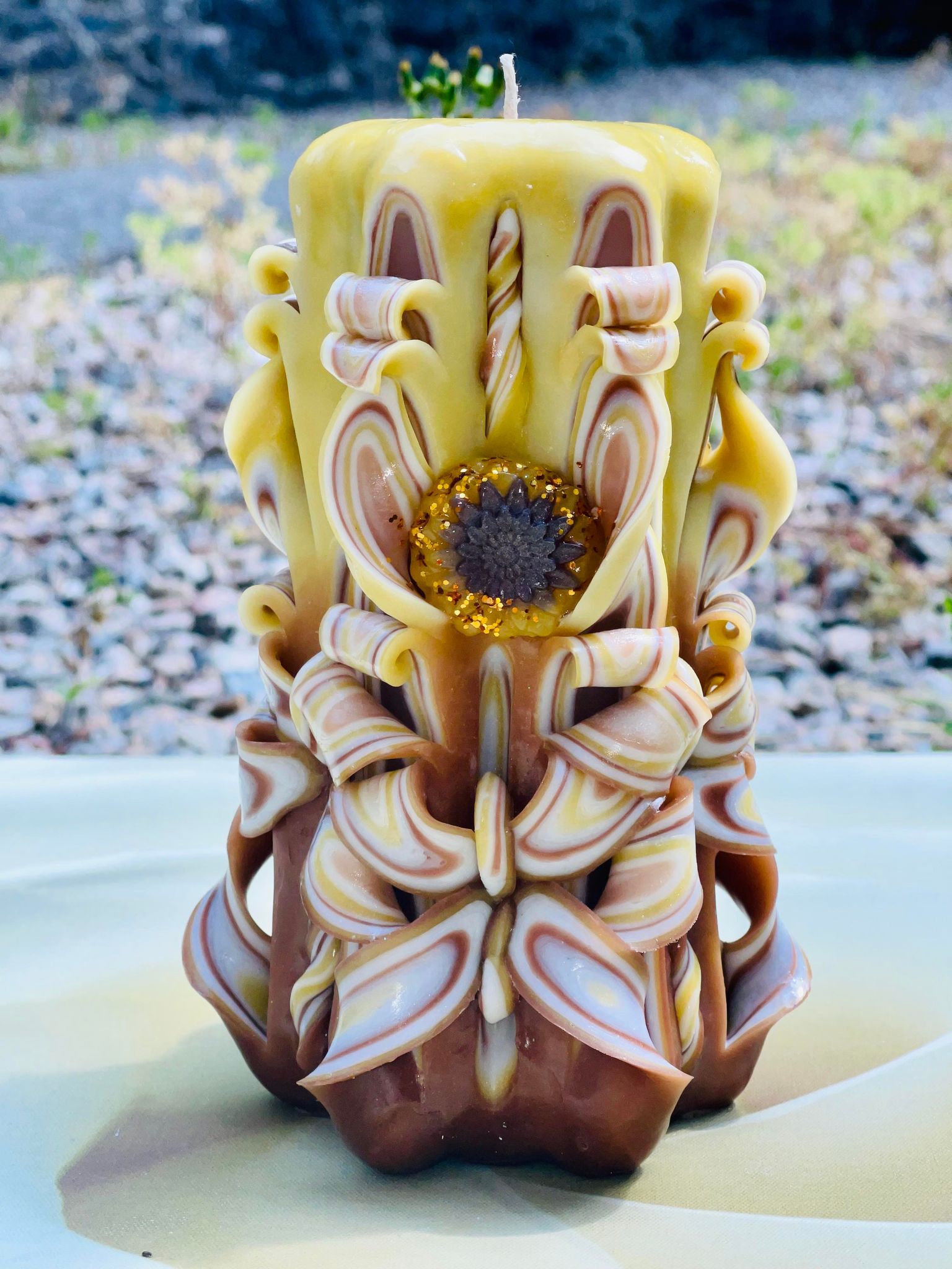 Handmade sunflower candle with floral design