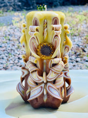 Handmade sunflower candle with floral design