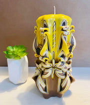 Handmade sunflower candle with floral design